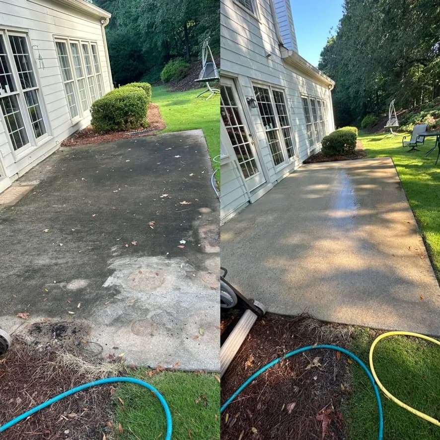 Backyard concrete patio half covered in dark algae and grime, then bright and uniform after pressure washing